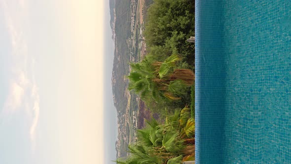 Vertical View of Outdoor Luxurious Pool on the Open Air with a Beautiful Sea on Costa Brava Spain