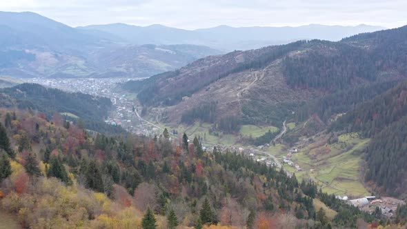 Small Village Along a Road in a Mountain Gorge Carpathian Mountains in Ukraine alt