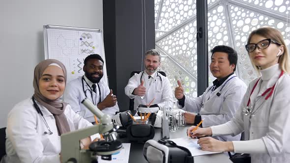 Doctors Team Posing on Camera in Hospital Office and Showing Sign Ok alt
