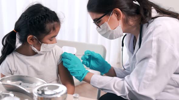 School Girl Visits Skillful Doctor at Hospital for Vaccination alt