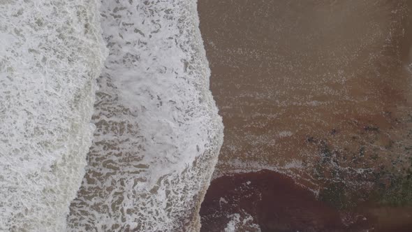 Ocean Waves Creating White Water on the Shores of a Beach alt