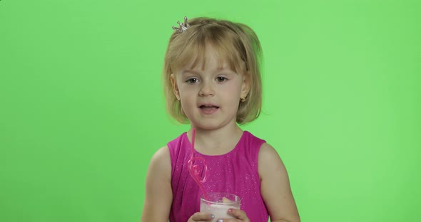 Happy Young Child Waving in Pink Dress with Milkshake Cocktail. Chroma Key alt