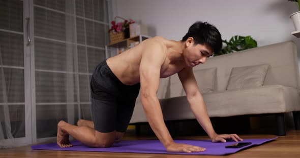 Man using phone and doing push up alt