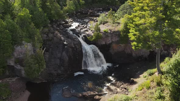 beautiful waterfall during summer time alt