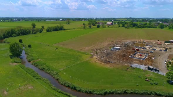 Aerial View of an Amish Barn Raising after a large fire destroyed them alt