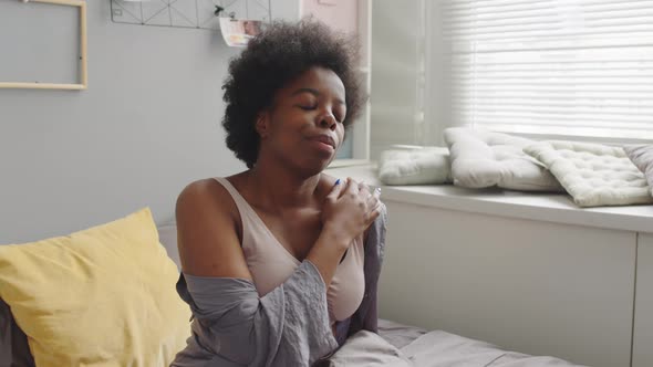 African American Woman Awakening in Bed alt