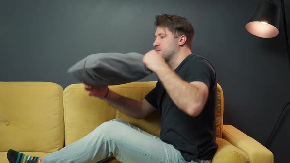 Depressed Unshaven Guy Suffering From Depression on Sofa