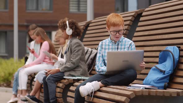 Pupils Using Gadgets Outdoors alt