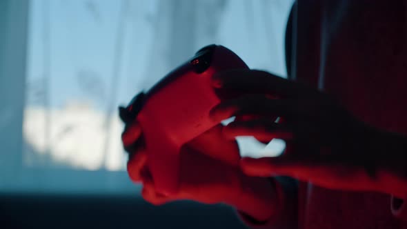 Young Male Hands Hold and Twirl Gamepad Rotate Shake and Test Controller