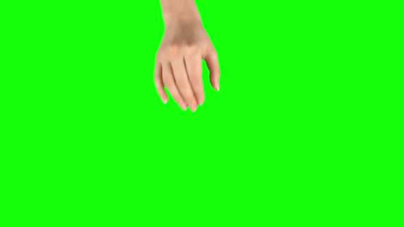 Female Hand Is Performing Spread at Tablet Screen Gesture on Green Screen. Close Up alt
