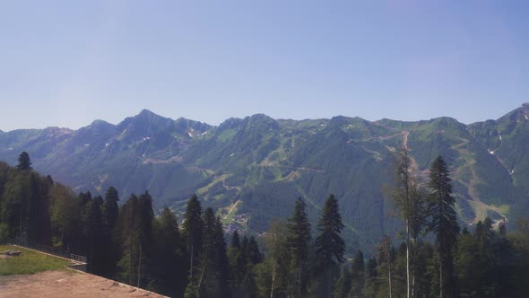 Mountain Range Ascent to the Top By Cable Car in a Cable Car alt