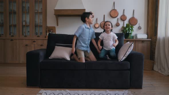Children Jumping on the Couch