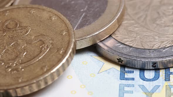cash coins and euro banknotes close-up.