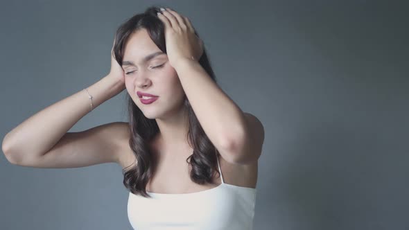 Pretty Brunette Female Woman Suffering From Ill Headache Holding Head with Hands alt