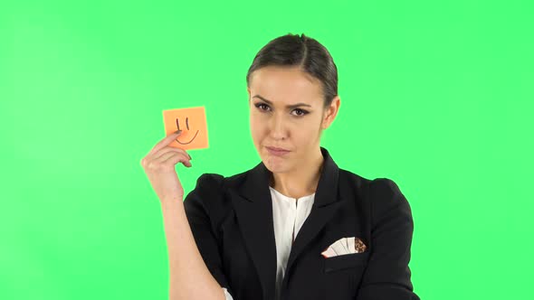 Girl Holding Paper Stick Expressing Awful Mood Then Takes Another Expressing Good Mood. Green Screen alt