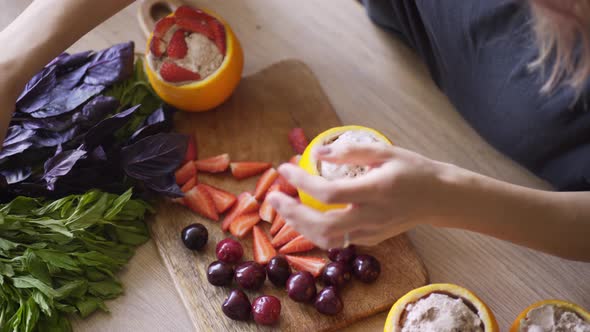 Female Cook Cuts Red Strawberry