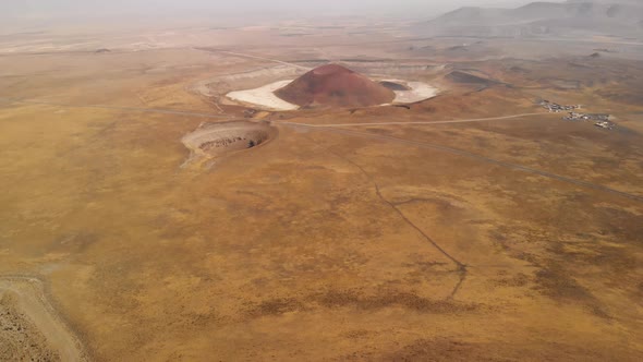 Aerial View Space Facility Base on Red Planet Mars Near a Volcano Crater
