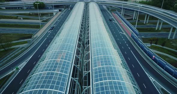 Aerial view of an entrance to the glass tunnel on the highway. alt