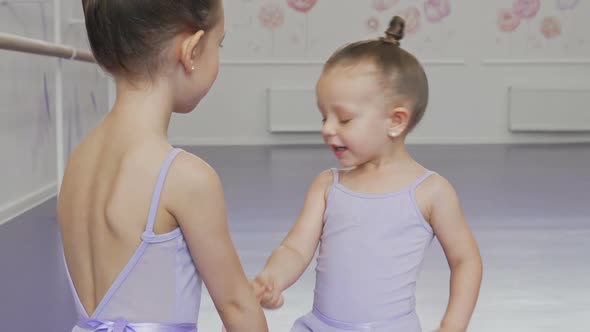 Adorable Little Ballerinas Having Fun at Ballet School
