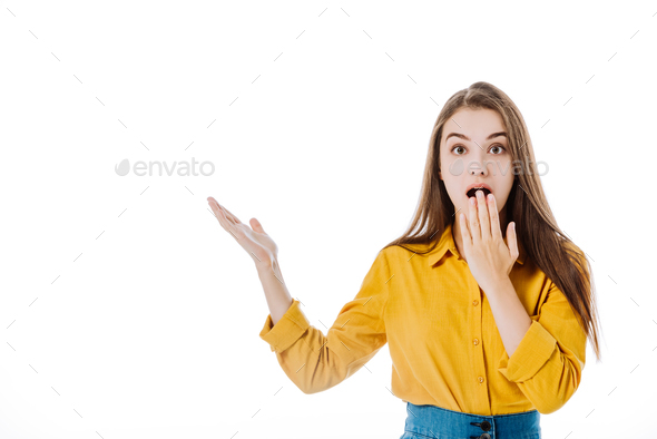 shocked attractive girl with open mouth pointing with hand isolated on ...