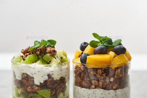 Close-up view of bunch of fresh ripe bananas isolated on white Stock Photo  by LightFieldStudios