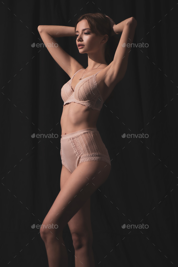 Girl in lingerie holding her hands bra. Stock Photo