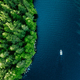 Aerial view fishing boat in blue lake and green woods in Finland - PhotoDune Item for Sale