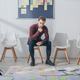 pensive businessman sitting on chair near sticky notes - PhotoDune Item for Sale