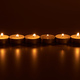 burning white candles glowing in dark - PhotoDune Item for Sale