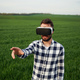 Conception of gaming. In virtual reality glasses. Handsome young man is on agricultural field - PhotoDune Item for Sale