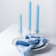 Blu linen napkins and blu candles on the white table - PhotoDune Item for Sale