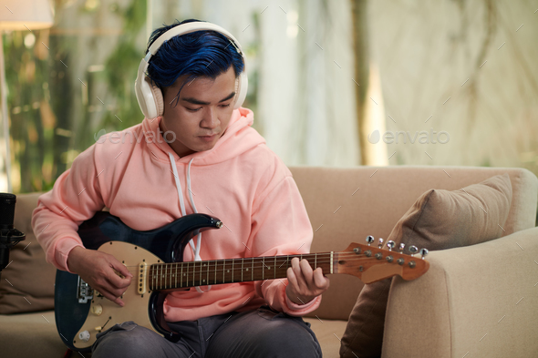 Music Composer Playing Guitar