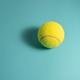 Tennis ball with light blue background - PhotoDune Item for Sale