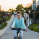Young woman on electro bicycle, concept of commuting and ecologic traveling. - PhotoDune Item for Sale