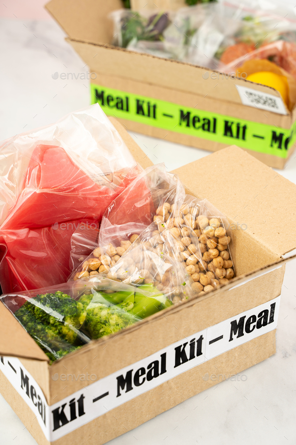 Online Home Food Delivery. Craft Box with packed tuna, shrimp, vegetables and recipe card