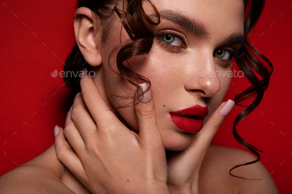 Beautiful woman with perfect skin on red background. Beauty and skin care concept. - Stock Photo - Images