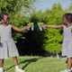Two african american girls playing in the park - PhotoDune Item for Sale