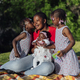 African family kissing in the park - PhotoDune Item for Sale
