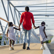 Black woman walking with her daughters - PhotoDune Item for Sale