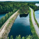 Aerial view of road with red car and train line railway over blue lake water in Finland - PhotoDune Item for Sale