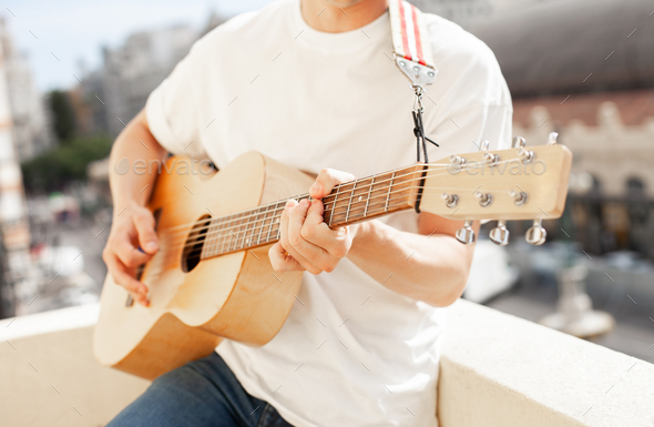 acoustic guitar in guitarist's hands. Guy holding guitar closeup - Stock Photo - Images