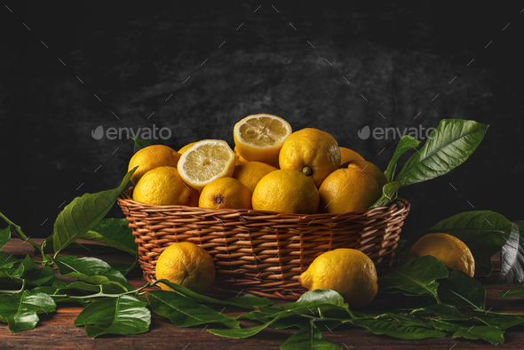 Fresh lemons in wooden basket - Stock Photo - Images
