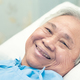 Asian elderly woman patient smile bright face with strong health while lying on bed in hospital. - PhotoDune Item for Sale