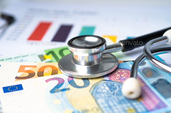 Stethoscope and EURO banknotes on chart or graph paper. - Stock Photo - Images