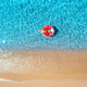 Aerial view of a young woman swimming with red swim ring - PhotoDune Item for Sale