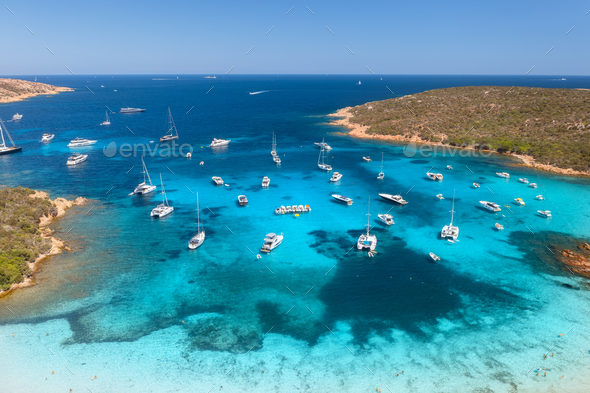 Aerial view of luxury yachts and boats on sea bay at sunset - Stock Photo - Images