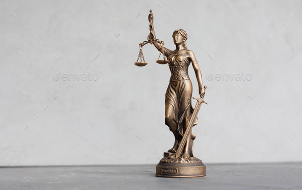 themis is goddess of justice statuette on dark background. symbol of law with scales  - Stock Photo - Images