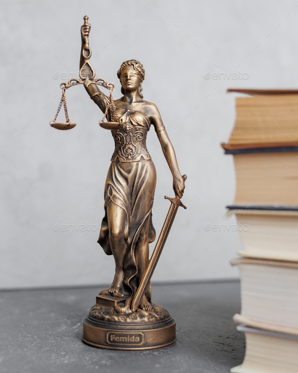themis goddess of justice statuette, symbol of law with scales and sword in his hands - Stock Photo - Images