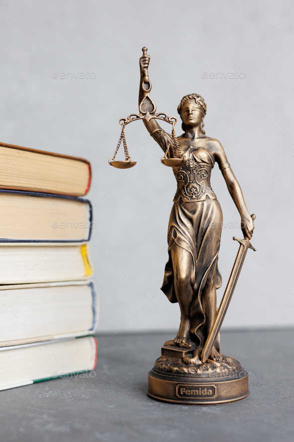 themis goddess of justice statuette, symbol of law with scales and sword in his hands - Stock Photo - Images