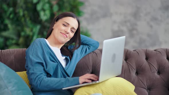Medium Shot Portrait of Happy Beautiful Freelancer Woman Using Laptop Looking at Camera alt